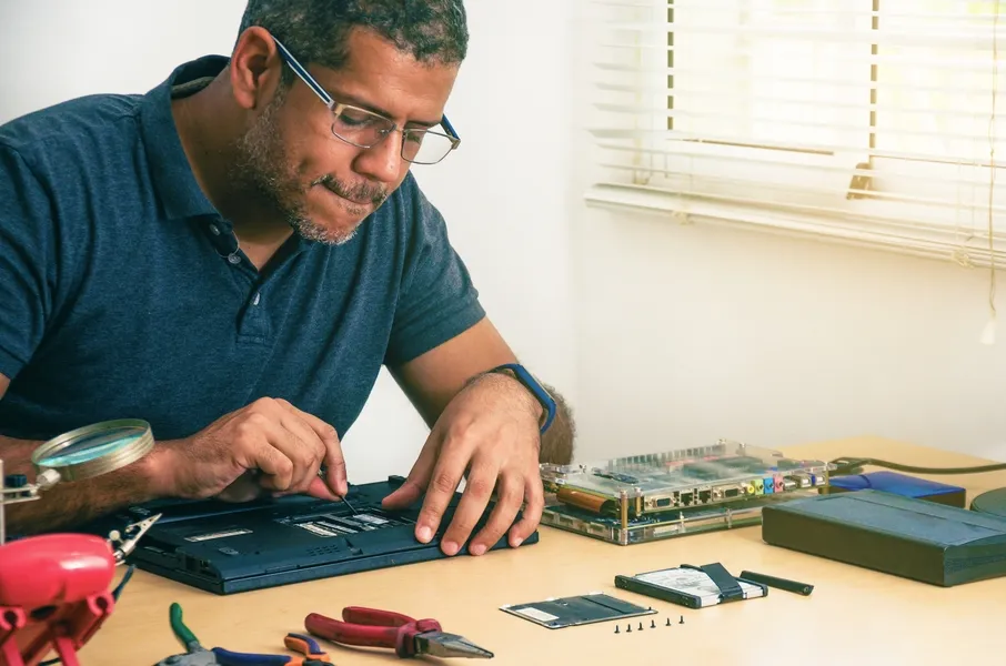 At Home Computer Repair Expert Upgrading Laptop RAM